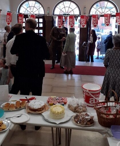 A picture of the entrance hall with cake sale stand