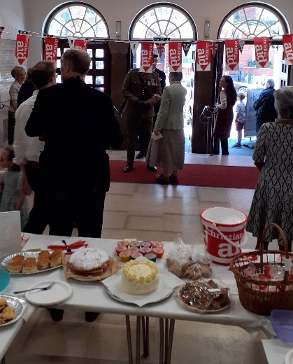 A picture of the entrance hall with cake sale stand