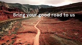 Quote "Bring your good road to us" on background of picture of a road