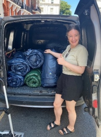 Olivia from Restart unloading van for Resource Fair